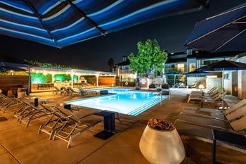 Outdoor pool area with lounge chairs